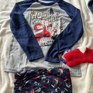 Brand new macys pajamas , never worn this one is a 2 piece with some warm socks